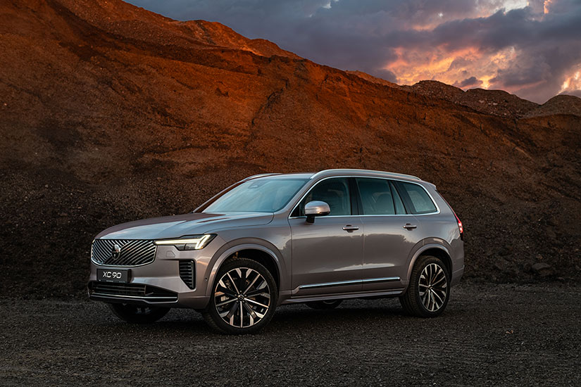 Volvo XC 90 in mountains at sunset